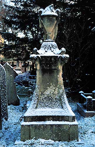 draped urn in snow