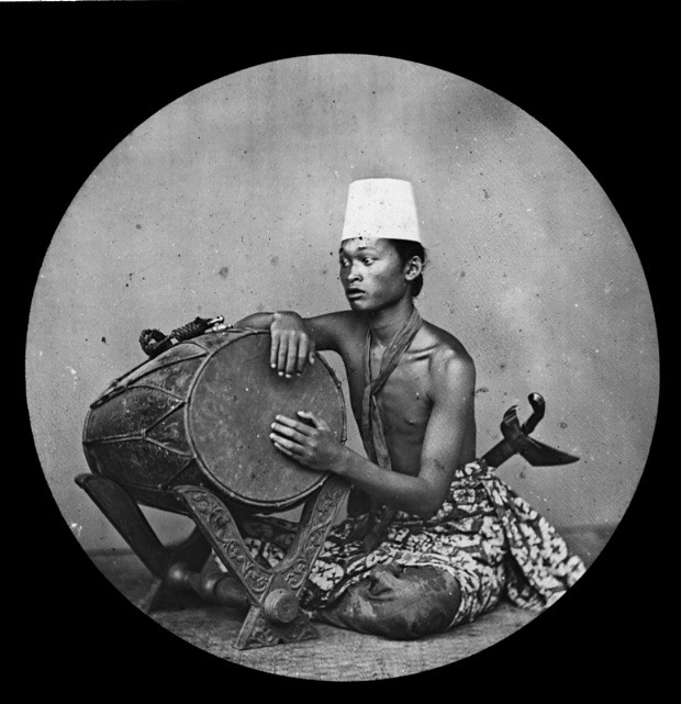 Javanese gamelan drummer - Photograhic Lantern slide