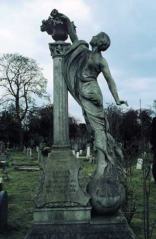 woman balanced on globe, placing flowers on coloum