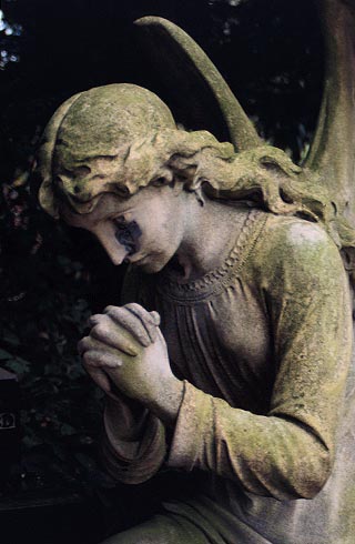kneeling angel at prayer