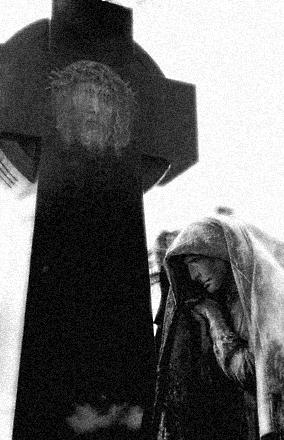 figure with christ head cross