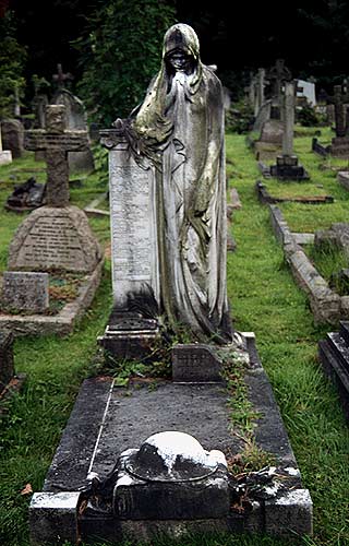 grieving woman looks at soldiers helmet